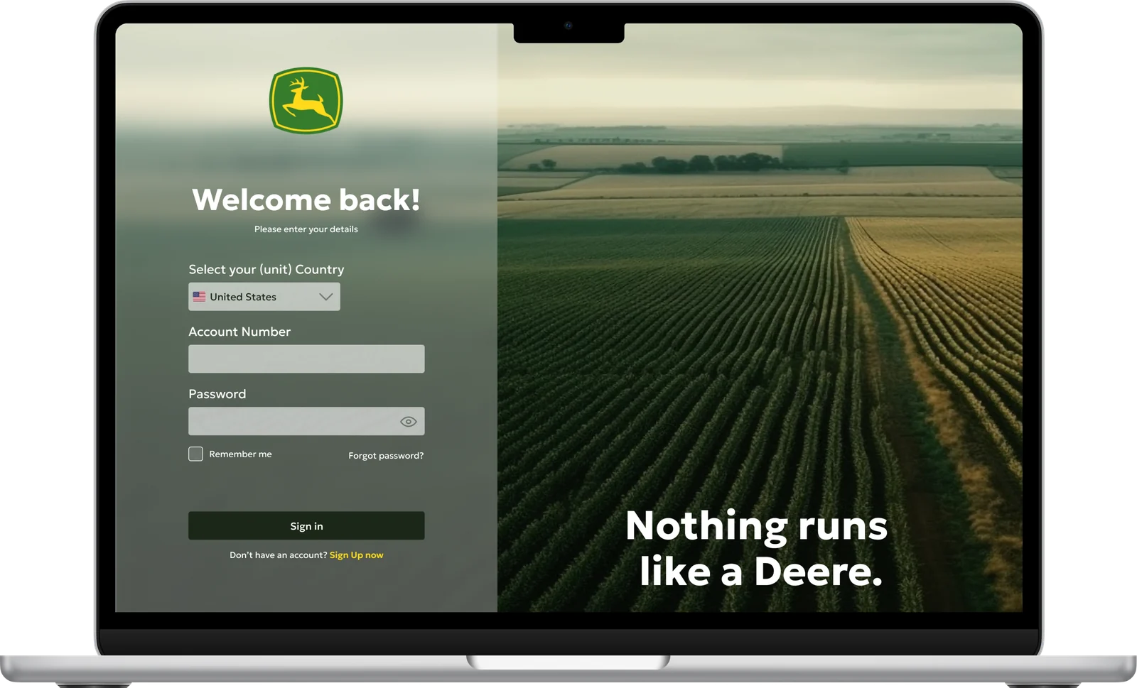 Laptop mockup of the John Deere customer portal login screen with a field landscape